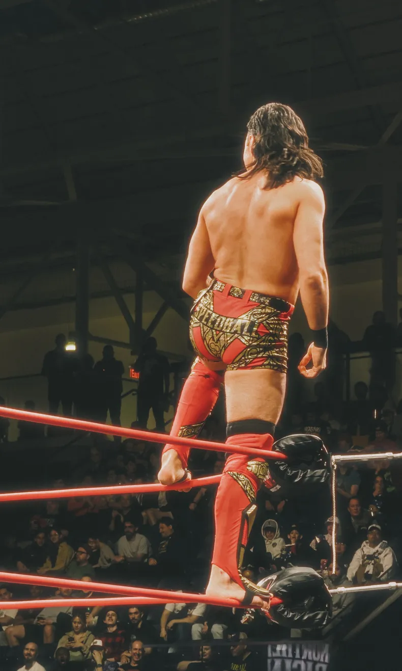 “Speedball” Mike Bailey poses on the top turnbuckle during his match.