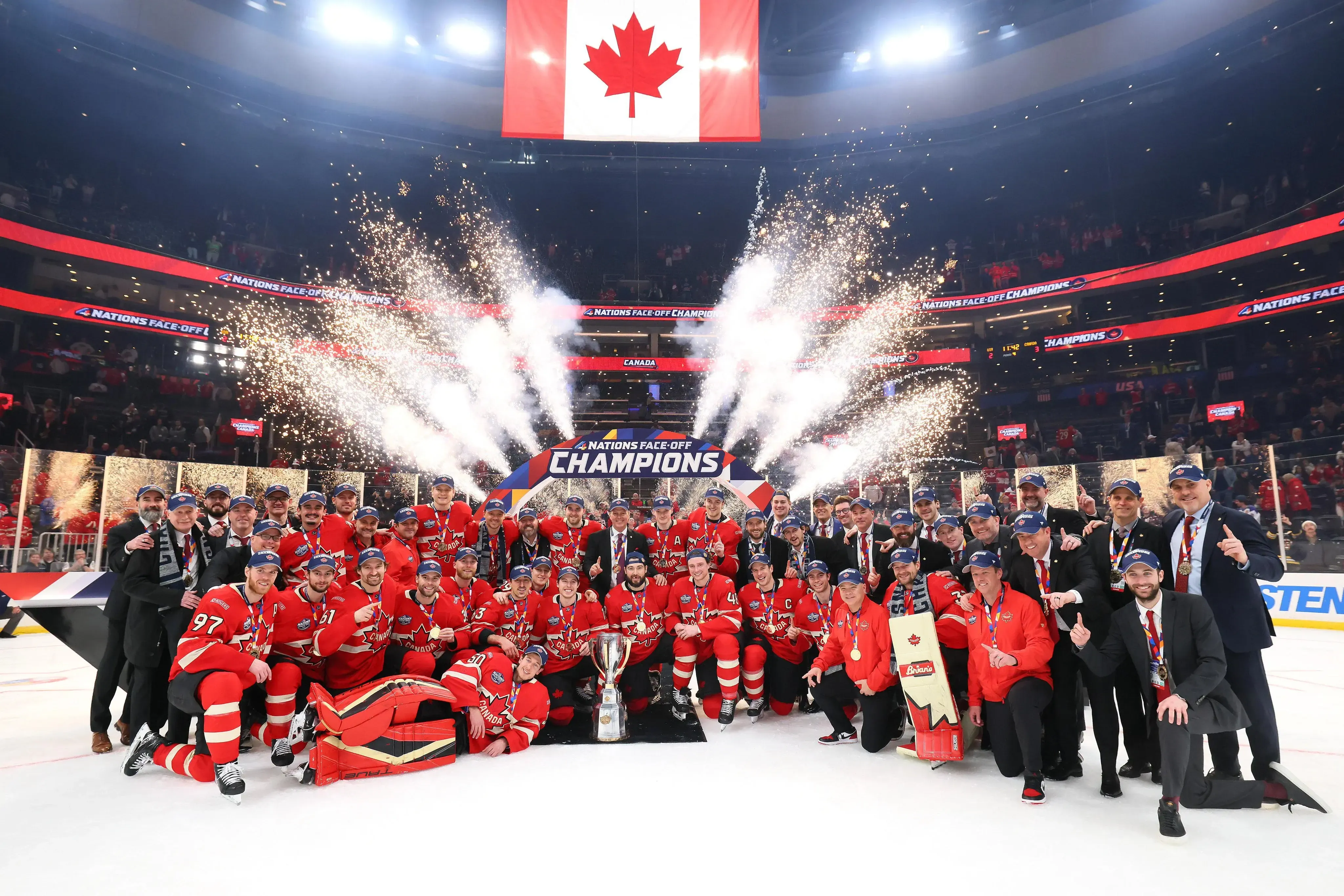 Team Canada posing for a team photo during the championship celebration of the Four Nations Tournament.